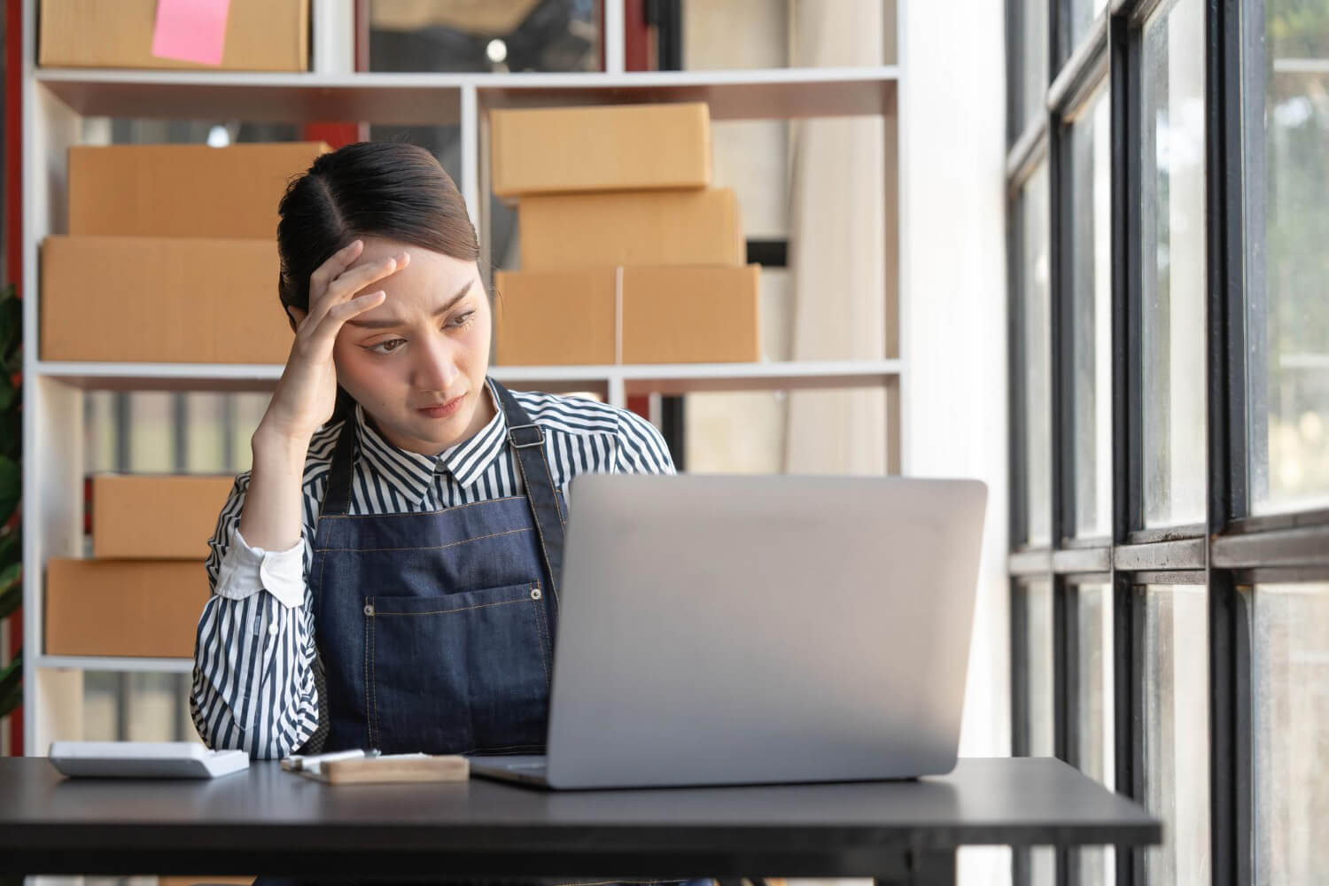 small business owner worried looking at computer