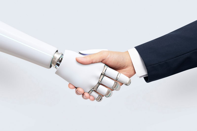 Man shaking hands with robot