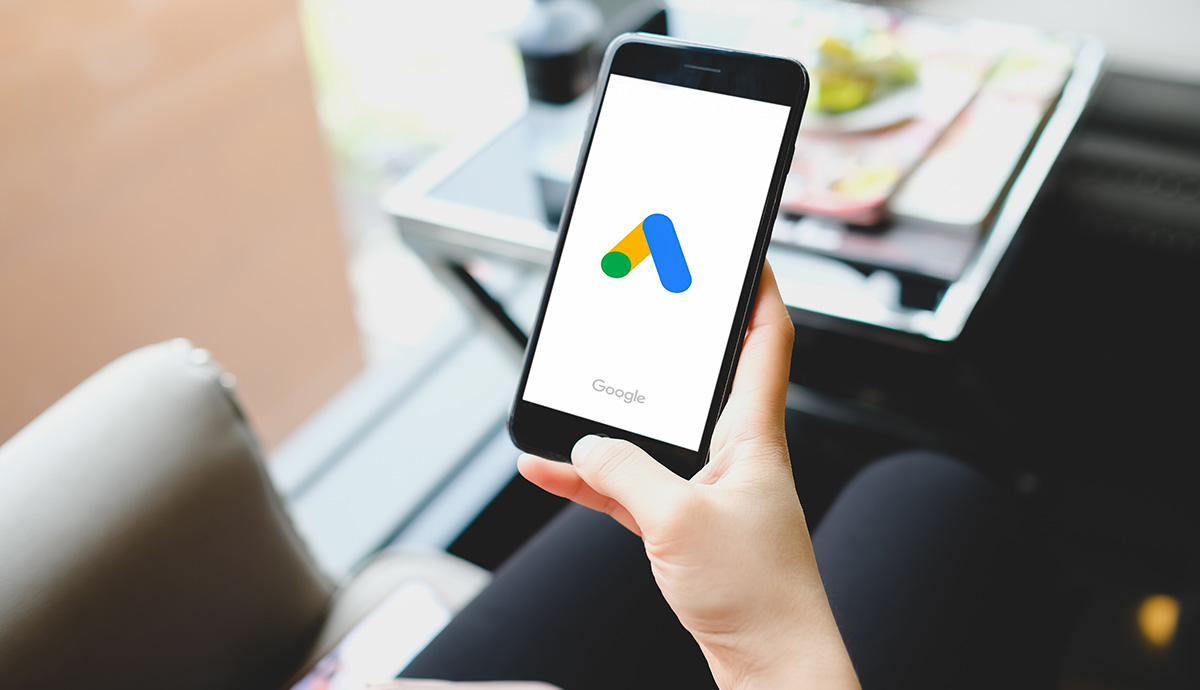 Woman pointing at google ads on her smartphone