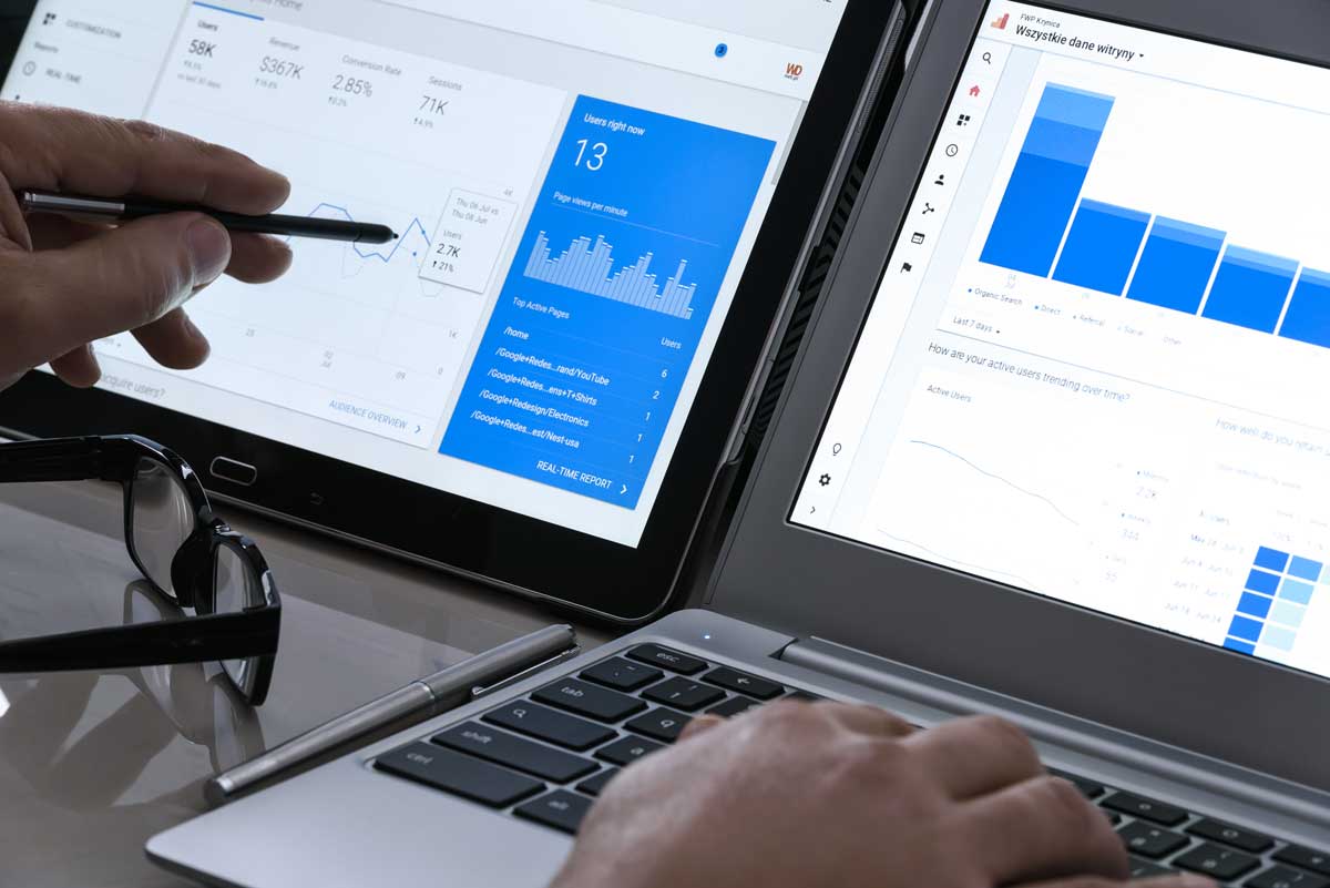laptop and touchscreen displaying website traffic analytics