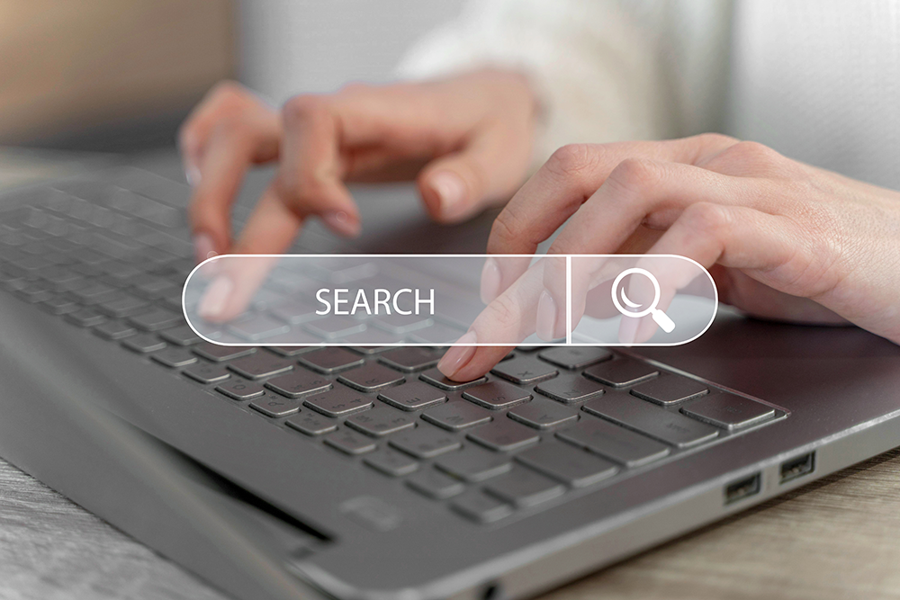 A person typing keywords