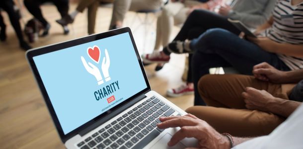Person looking at a charity website on their laptop