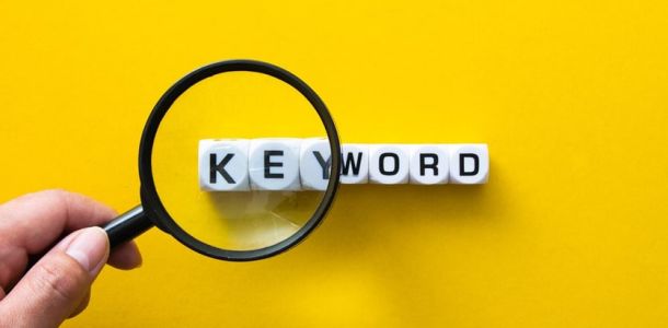 Magnifying glass over blocks that spell keyword