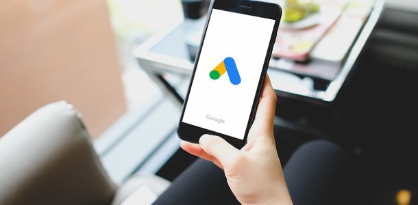 Woman pointing at google ads on her smartphone