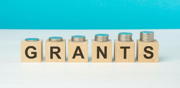 Wooden blocks spelling out the word grants