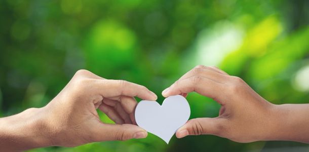 2 People holding a heart
