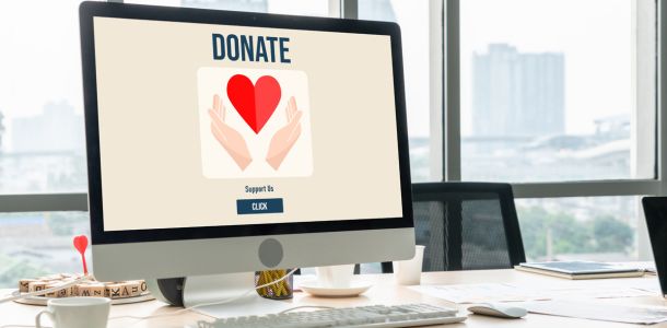 Image of a laptop displaying a donation platform