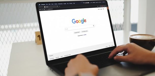 Person on laptop using Google