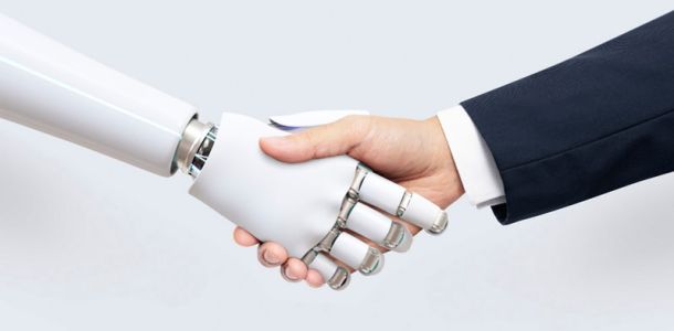 Man shaking hands with robot