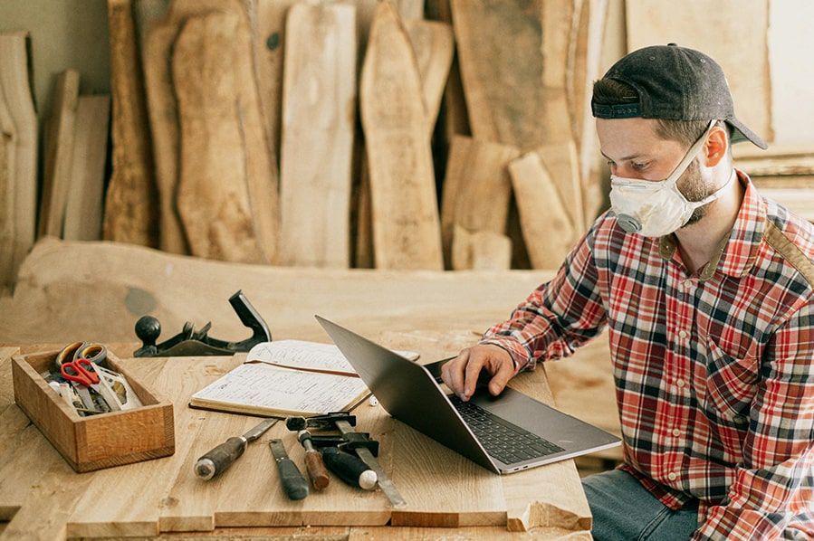 Small business owner checking their laptop