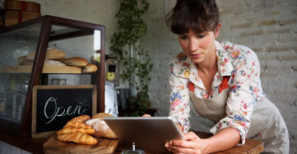 woman using digital tablet