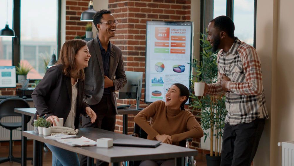 office, team laugh, analytic results in background