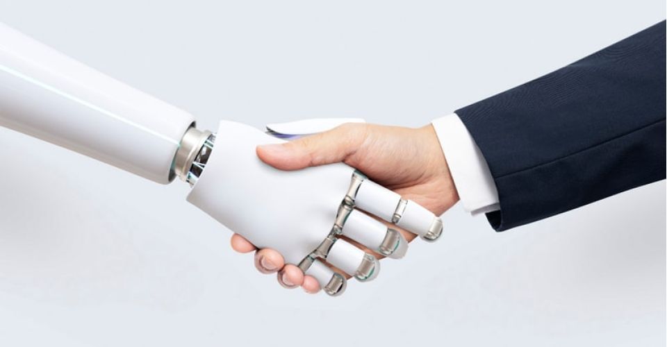 Man shaking hands with robot