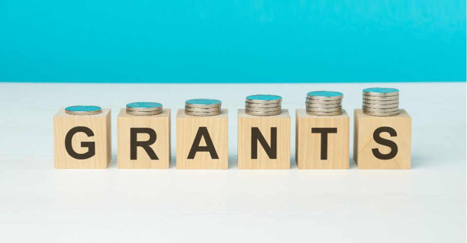 Wooden blocks spelling out the word grants