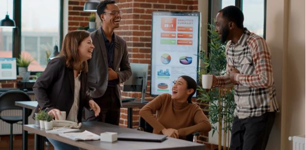 office, team laugh, analytic results in background