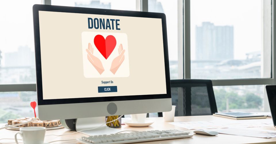 A PC monitor showing a donation message