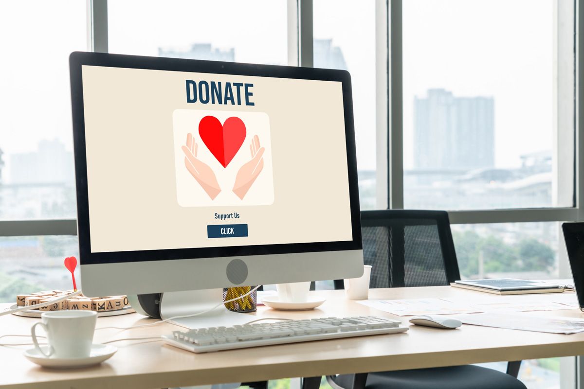 Image of a laptop displaying a donation platform