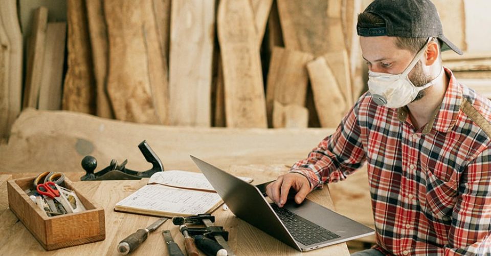 Small business owner checking their laptop